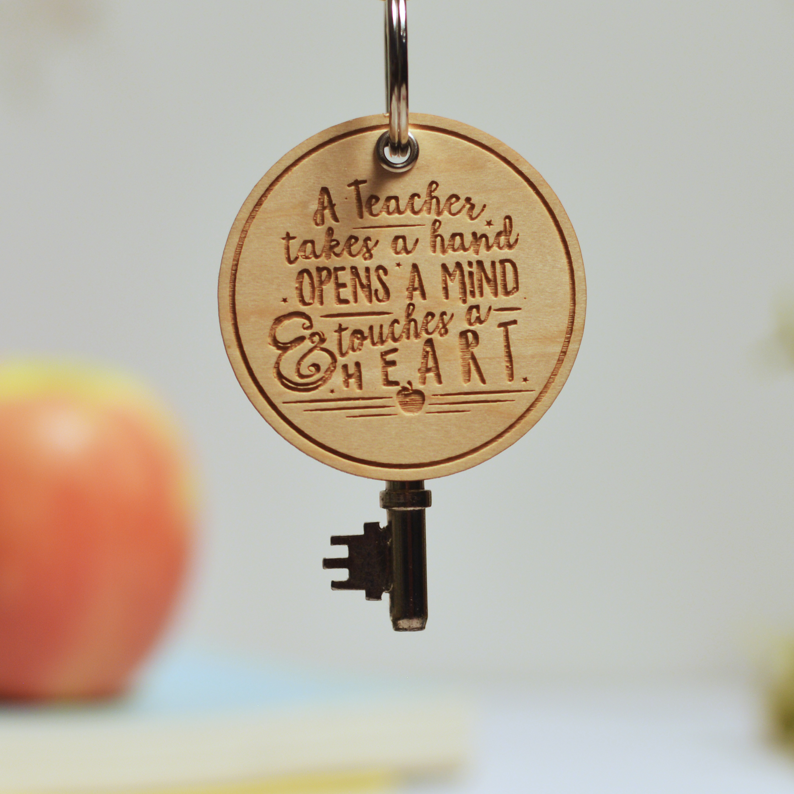 A teacher takes a hand Keyring